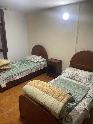 Postel nebo postele na pokoji v ubytování Kouta hotel