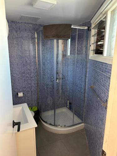 a bathroom with a shower with a glass door at Il Ducale a Playa del Inglés in Playa del Ingles