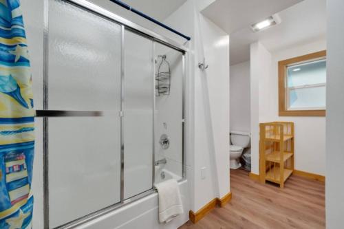 a bathroom with a shower and a toilet at Cottage By The Sea Nedonna Beach Getaway in Rockaway Beach