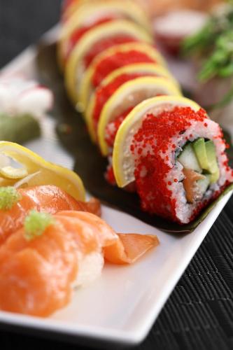 a white plate with sushi on a table at South Point Antigua in English Harbour Town