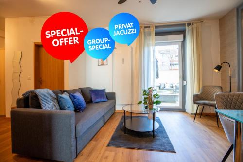 a living room with a couch and a table at Special ROGER F RABBIT 1 Apartment, Roche Towers, 10-STAR in Basel