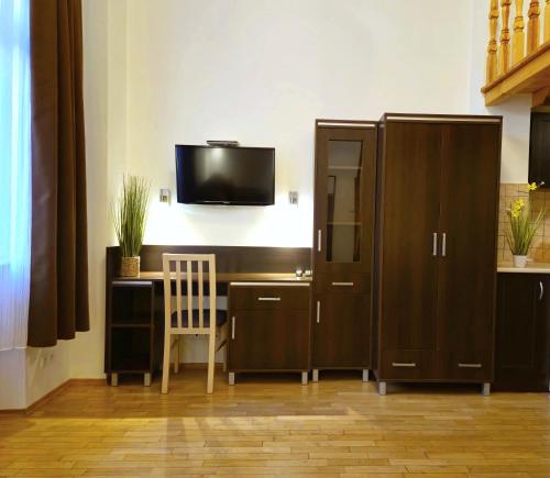 Televízia a/alebo spoločenská miestnosť v ubytovaní Safona - Pantheon Apartments