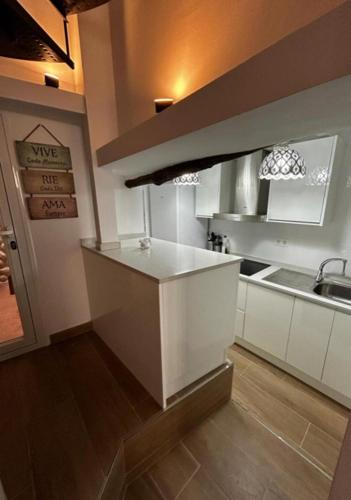 a kitchen with a sink and a counter top at Casa María Lanjarón in Lanjarón