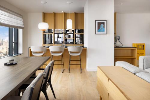 a kitchen and living room with a table and chairs at Timbri Hotel San Francisco, Curio Collection by Hilton in San Francisco