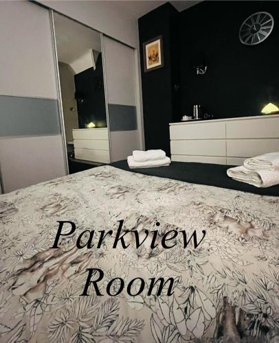 a bedroom with a bed with a bathroom room at THE LOG CABIN HOSTEL 3 Bays 211 in Leicester