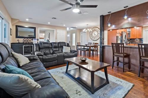 a living room with a couch and a table at Huge House-Yard-Pool Hot Tub in Citrus Heights