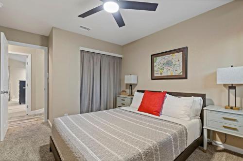 a bedroom with a bed and a ceiling fan at Huge House-Yard-Pool Hot Tub in Citrus Heights