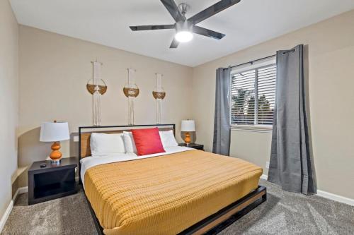 a bedroom with a bed and a ceiling fan at Huge House-Yard-Pool Hot Tub in Citrus Heights