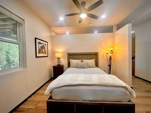 a bedroom with a bed and a ceiling fan at Villa Hermosa- Guest Quarters in Prescott