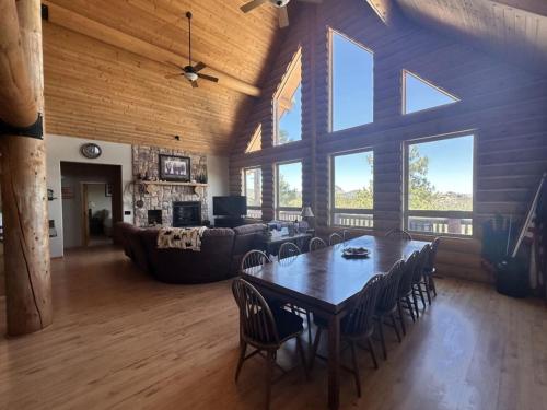 a large living room with a table and chairs at Hilltop Chalet- Stunning Views 3mi from downtown in Prescott