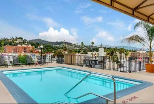 a swimming pool with a view of a city at Stylish Hollywood Hideaway 1Bed Rooftop Pool with Iconic View D in Los Angeles