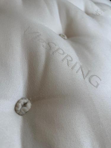 a close up of a white shirt with the word faith on it at New Forest Cozy 3-Bed Family Cottage, PaultonsPark in Bartley