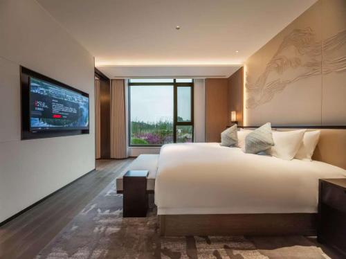 Ένα ή περισσότερα κρεβάτια σε δωμάτιο στο S&N Hotel De'an