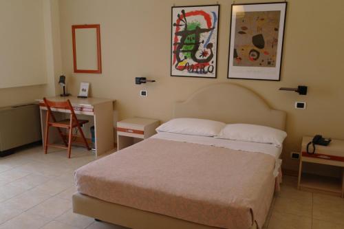 Кровать или кровати в номере Hotel Armando' s