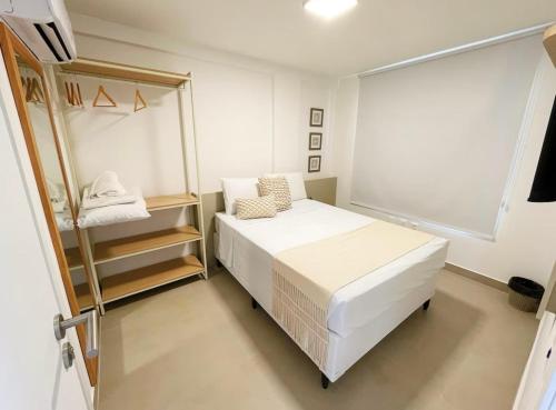 Ένα ή περισσότερα κρεβάτια σε δωμάτιο στο Térreo com 3 suítes beira-mar