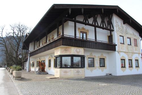 a large building with a balcony on top of it at Erlebnislandgasthof Hotel Neiderhell in Kleinholzhausen