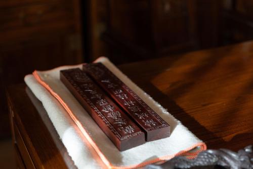 two pieces of chocolate on a napkin on a table at Datong Yunzhong Traditional Courtyard in Datong