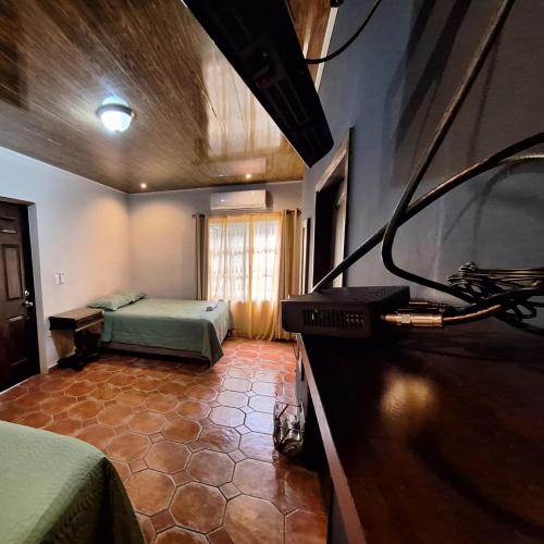 a bedroom with a bed and a window in a room at Palmerola Inn in Villa de San Antonio