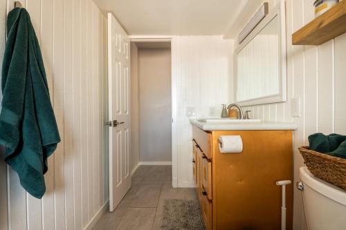 a bathroom with a sink and a toilet in it at Cozy Getaway - Perfect Base for Exploring Colorado Springs in Colorado Springs