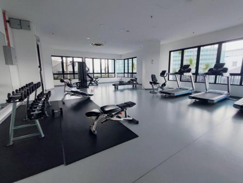 a gym with several exercise bikes and chairs in it at ISoHo i-City Studio 2 beds in Shah Alam