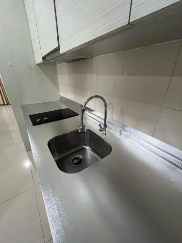 a stainless steel kitchen sink with a faucet at JZ ISoHo i-City Studio 2 beds in Shah Alam