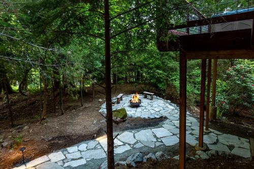 a fire pit in the middle of a forest at Bellingham A-Frame - Hot tub - Fireplace - Firepit in Bellingham