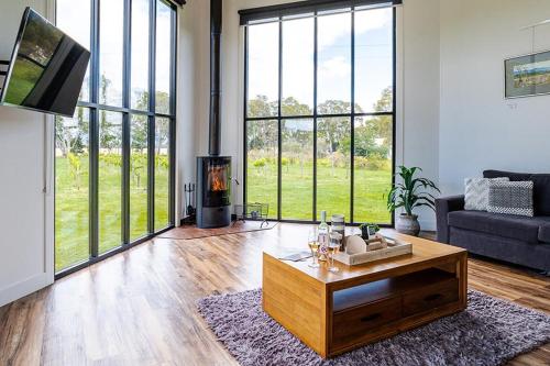 a living room with a couch and a coffee table at Pomonal Estate Villas in Pomonal