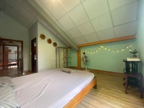Кровать или кровати в номере Cối Xay Gió Homestay Quảng Bình
