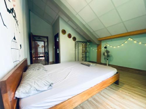 Кровать или кровати в номере Cối Xay Gió Homestay Quảng Bình