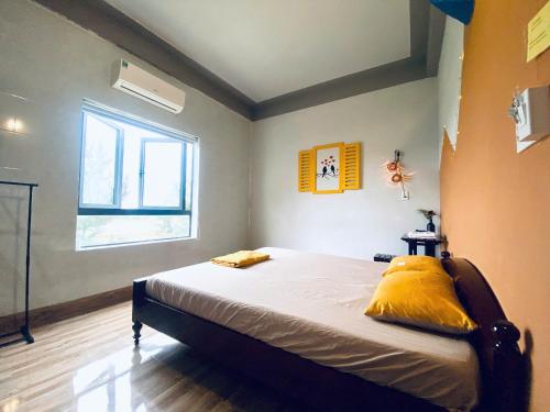Кровать или кровати в номере Cối Xay Gió Homestay Quảng Bình