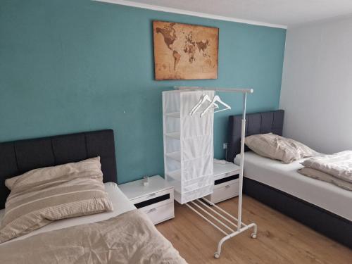 Postel nebo postele na pokoji v ubytování Ferienwohnung am Waldrand