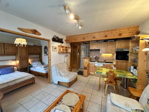 a room with a kitchen and a living room at Appartement à Villard-de-Lans, 4 pers, 37 m² - FR-1-515-224 in Villard-de-Lans