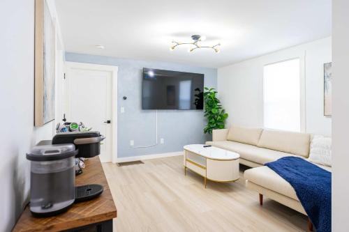 a living room with a couch and a table at Modern East Boston 2 Bed 2 Bath in Boston