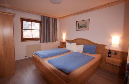 מיטה או מיטות בחדר ב-Activ Wellness - Appartement Schermerhof