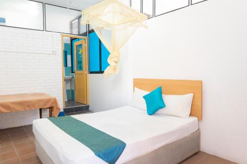 Postel nebo postele na pokoji v ubytování Blumarine Guest House