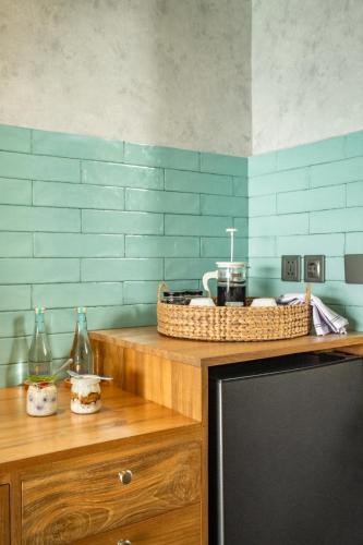 a kitchen with a counter with two baskets on it at Villa Damai Rohani in Sidemen
