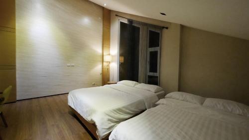 Ένα ή περισσότερα κρεβάτια σε δωμάτιο στο One House Luxury Home Unit2