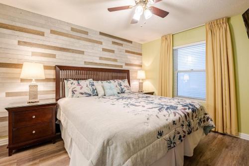 a bedroom with a bed and a ceiling fan at Seaside Serenity - Destin, FL in Destin
