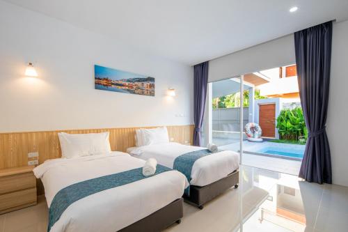 Ένα ή περισσότερα κρεβάτια σε δωμάτιο στο Sasi Pool Villa Phuket