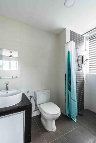 a bathroom with a toilet and a sink and a shower at Seascape Villa - NEW Private Pool in Langkawi Islands