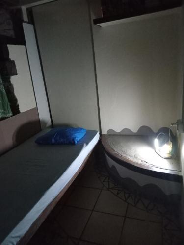 Postel nebo postele na pokoji v ubytování Chez Hina no Pacifica