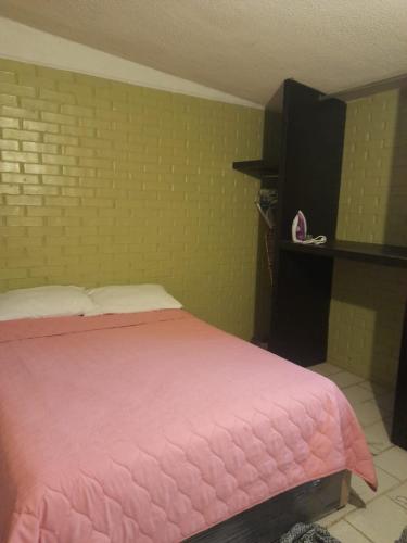 Postel nebo postele na pokoji v ubytování Departamento Mamá Rosita