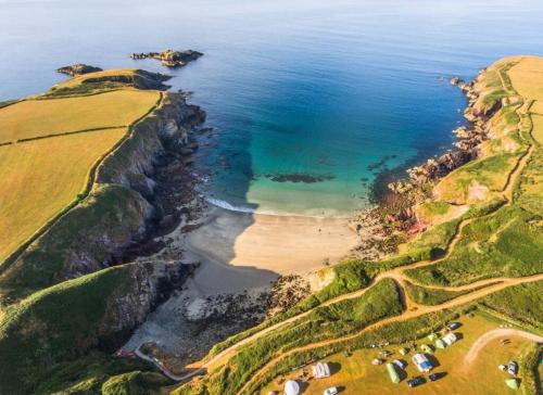 an aerial view of a beach and the ocean at Ty Marlyn in St. Davids
