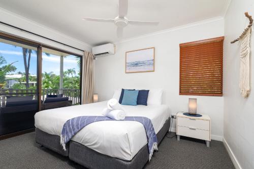 Ένα ή περισσότερα κρεβάτια σε δωμάτιο στο Tropical Reef Apartments
