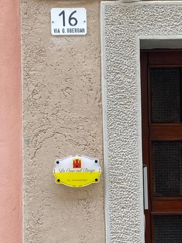 a yellow and white object on the side of a building at La Casa nel Borgo in Muggia