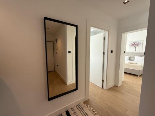 a mirror hanging on a wall in a room at Terra in Elea