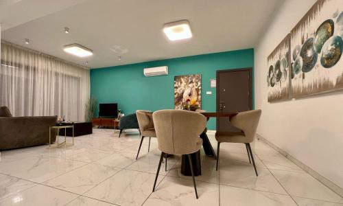 a dining room with a table and chairs at Cosmos Residence in Paralimni