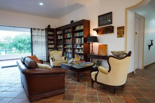 a living room with a couch and chairs and a table at Kili Seasons Hotel in Arusha