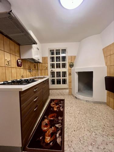 a kitchen with a sink and a stove top oven at Centro Storico Di Tea in Turi