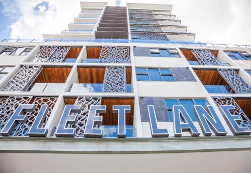 a sign on the side of a tall building at Fleet Lane Apartments in Brisbane